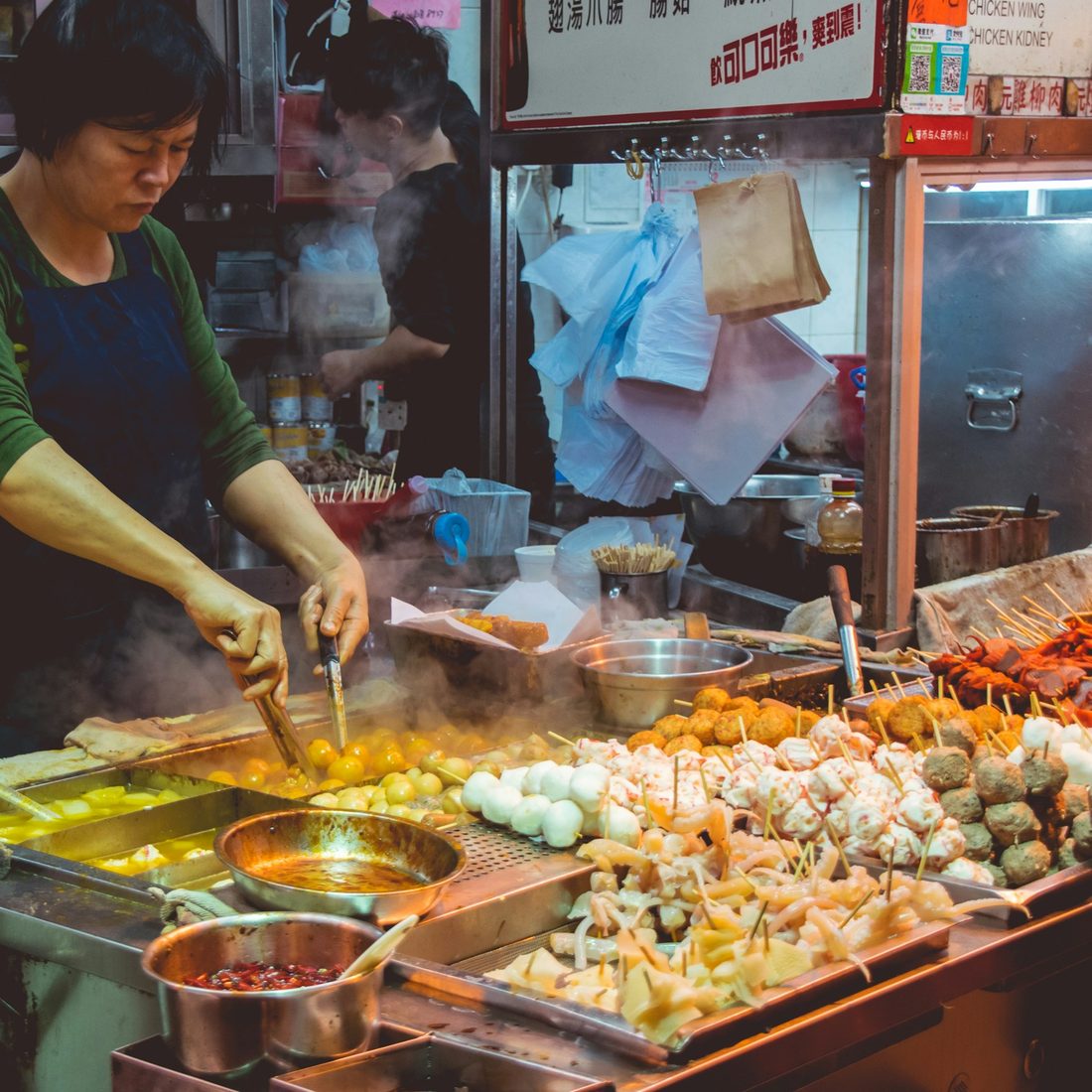 Wok cooking over open flame, island-street style
